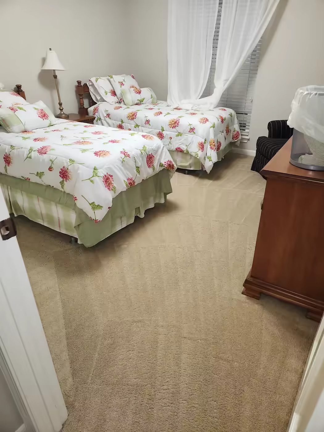 Freshly cleaned carpet in a bright furnished Pro-Techs customer bedroom